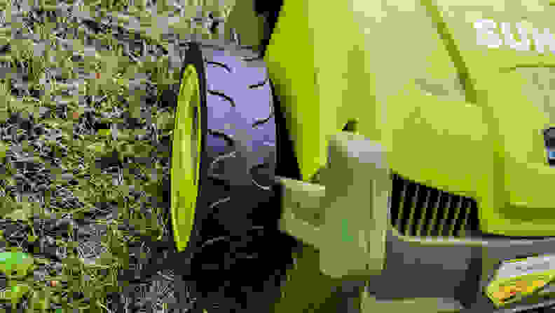 Close-up of a black wheel on a lawn tool