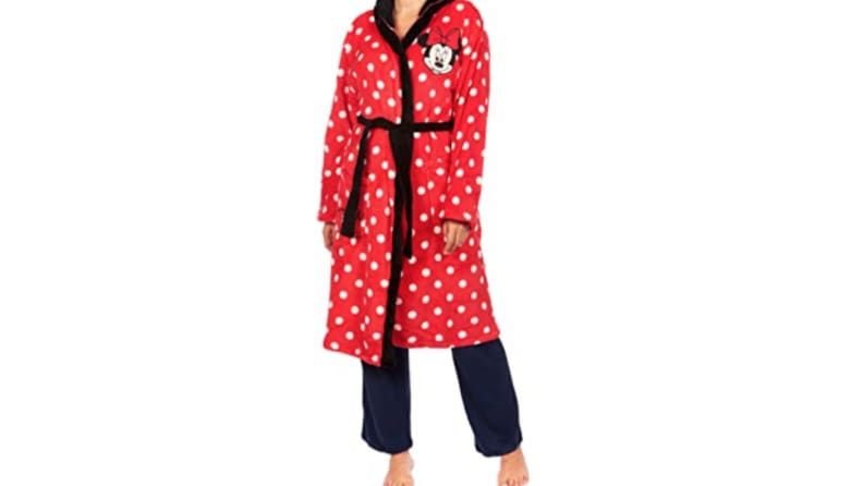 An image of a woman wearing a red and white polka dotted Minnie Mouse themed robe.