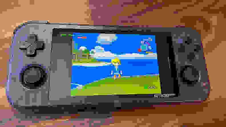 Looking at a purple gaming handheld with Legend of Zelda: Wind Waker on it