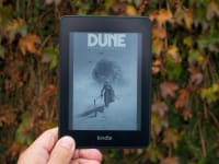 A hand holding an ebook reader