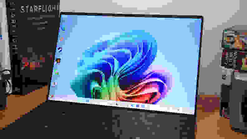 Close-up shot of the dell xps 13 display on a colorful background image.