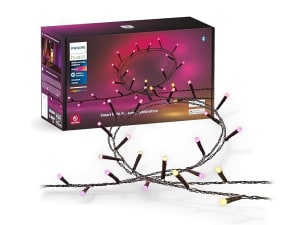 White string lights on evergreen garland above a string of colored lights