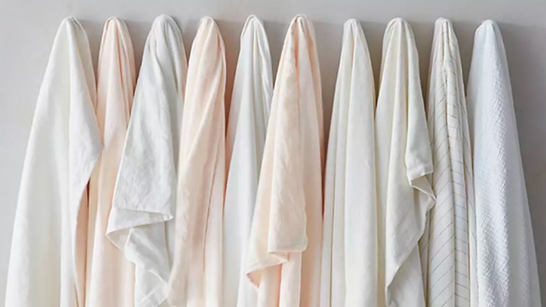 Picture of different linens hanging in a line next to each other.