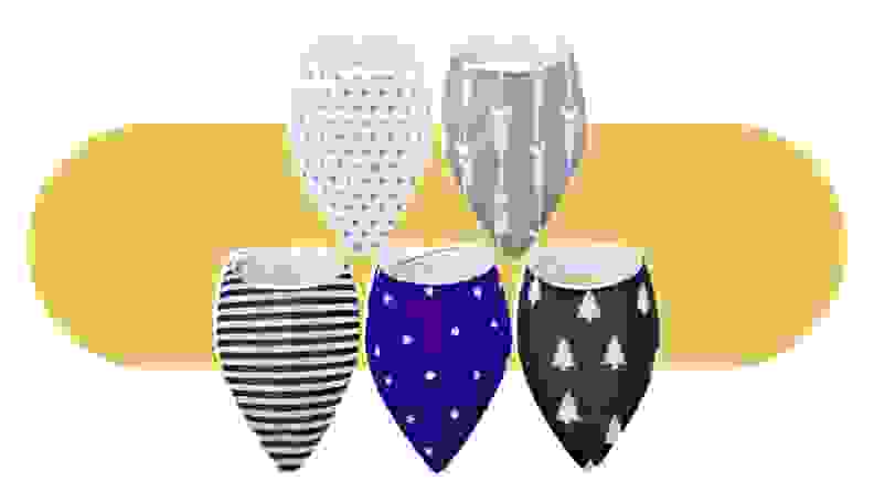 A collection of Janmercy bibs in various patterns on a colorful background.