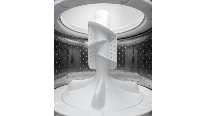 A shot of GE GTW335ASNWW top-load washing machine with pole agitator's interior drum, taken from within the drum itself.