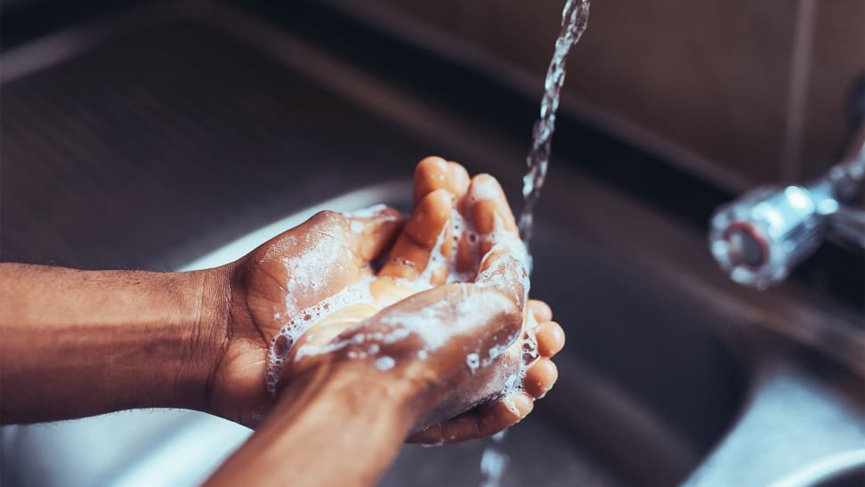 A photo of a person washing their hands.