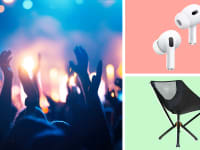 A group of people waving their hands in the air at a concert, Apple Airpods, and a chair.