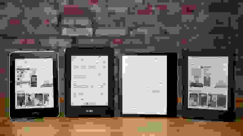 Four e-readers standing vertically in a line