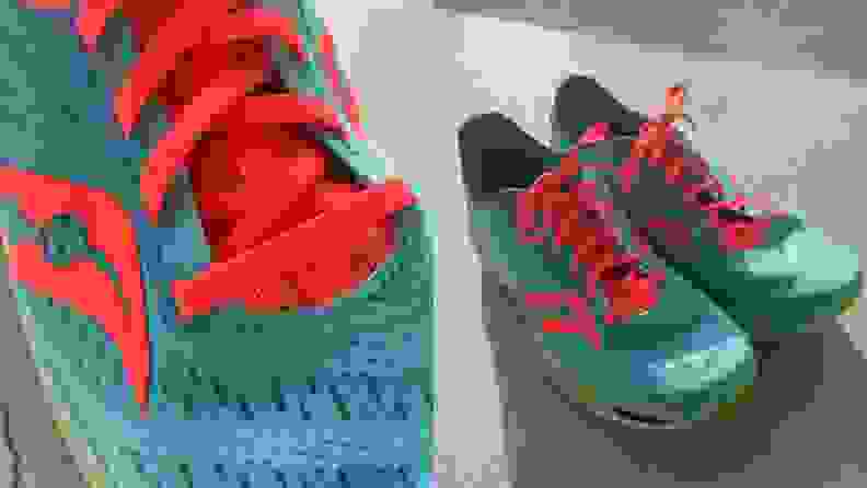 Close-up of Saucony Endorphin Speed running shoes in Spring / Future colorway, pair of Saucony Endorphin Speed running shoes sitting next to each other on the ground.