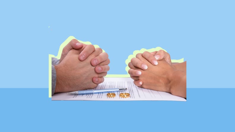 Two hands closed across from each other on a table against a blue background.