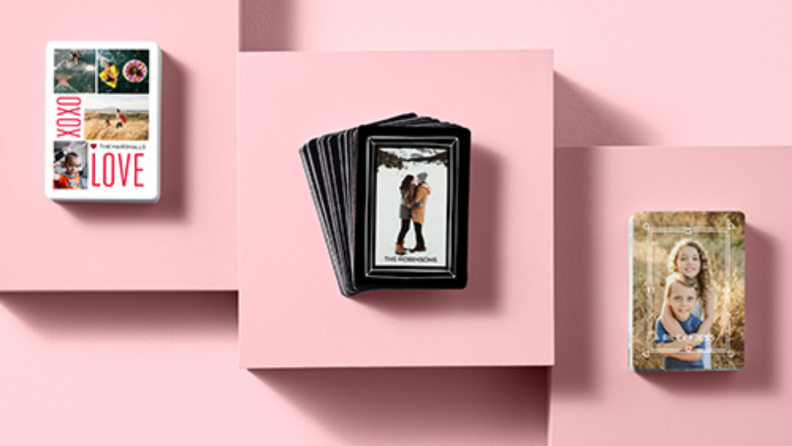 Three sets of personalized playing cards on a pink background