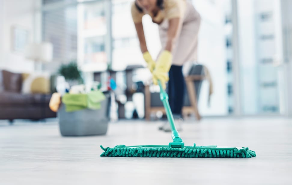 A person mopping the floor.