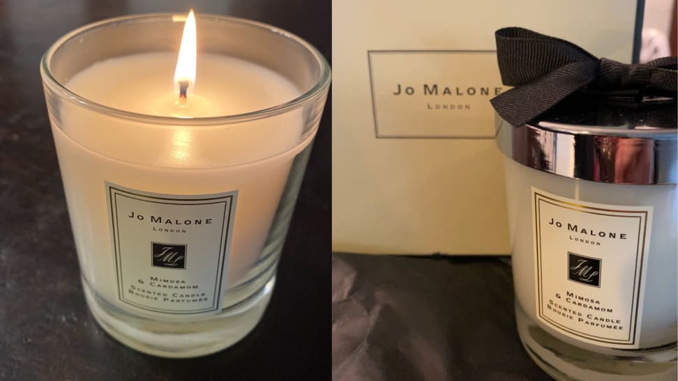 On left, Jo Malone Mimosa and Cardamom Home Candle burning. On right, Jo Malone Mimosa and Cardamom Home Candle in original packaging.