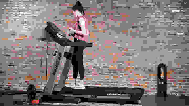 woman standing on nordictrack commercial 1750 treadmill