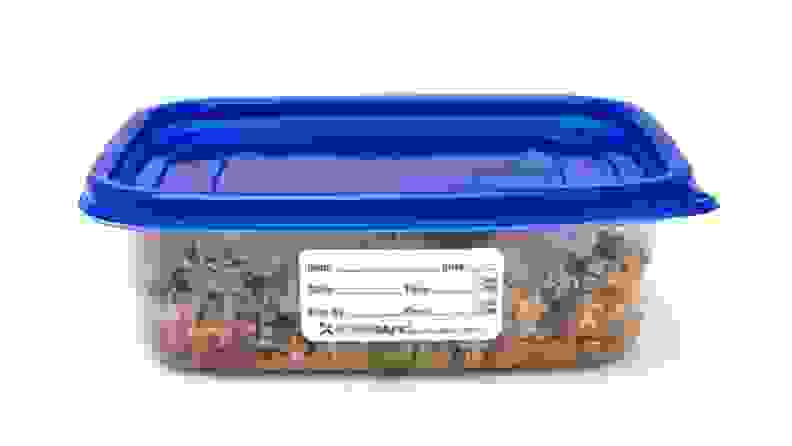 Tupperware with food label on it.