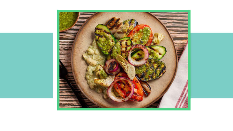 Plate of grilled vegetables and avocado.