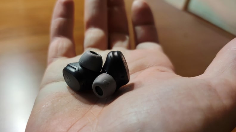 Skullcandy Mod XT earbuds in the palm of a hand