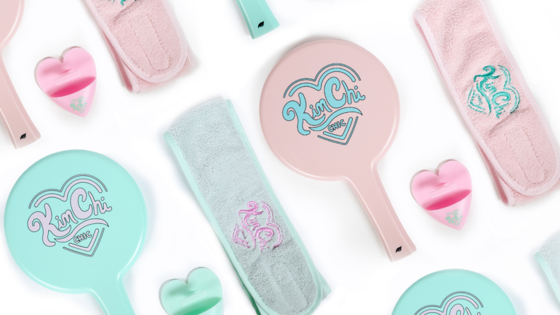 Pastel green and pink hand mirrors and spa accessories.