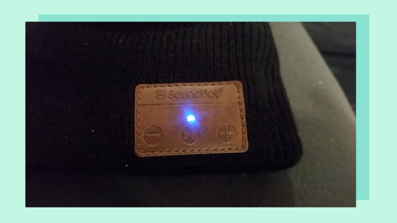 Close up of a beanie label with bluetooth light visible.