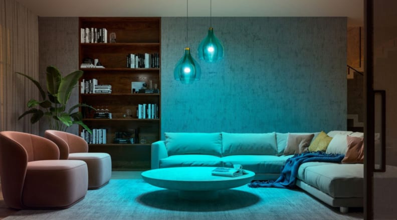 Well decorated living room with two pendant lights with blue lights