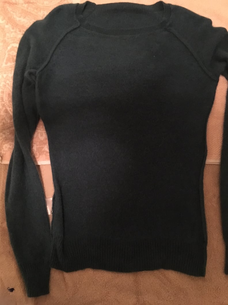 Lay the sweater out flat on a clean towel