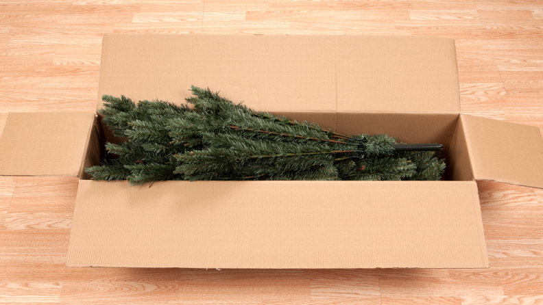 A Christmas tree inside a box.