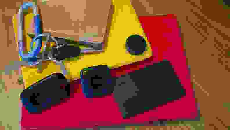 Several black squared devices on top of red and yellow