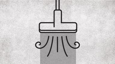 A graphic of a vacuum sucking up a rug