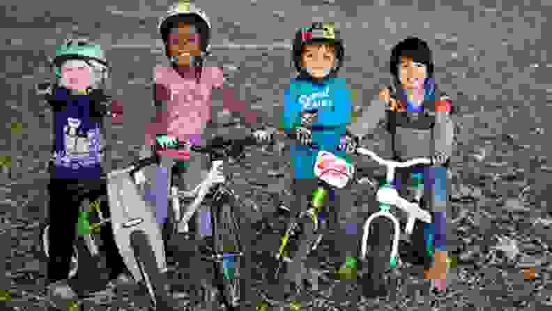 A line of kids on their bikes wearing ZippyRooz gloves
