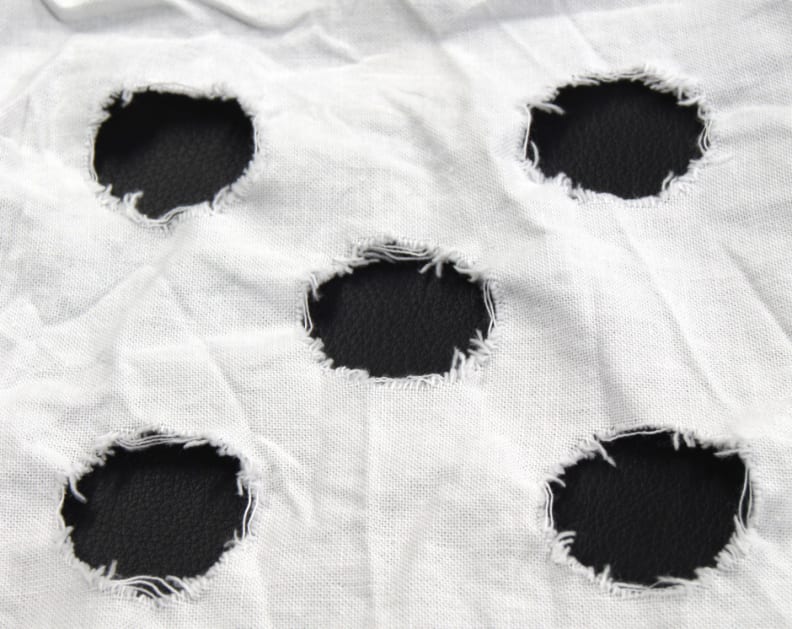 This is an example of a used mechanical action strip. The frayed strains within the circles are tallied up to determine the amount of clothes wear.