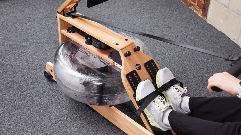 Shot of the water rower mechanism and feet strapped in.