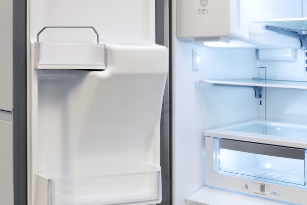 Models with through-the-door dispensing get a rather bulky internal ice maker, as well as adjusted door shelving to accommodate it.