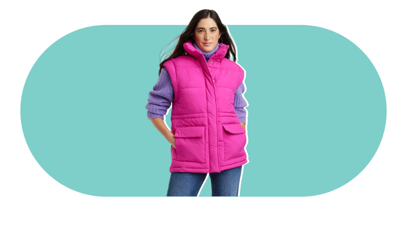 A model wearing a bright pink puffer vest with pockets.