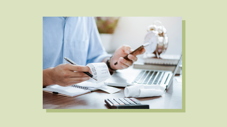 Person crunching numbers for personal finances while using phone, calculator and laptop computer.