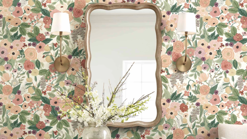 Mirror on top of multicolored wallpaper in home