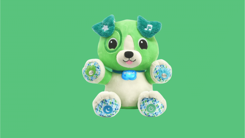 A puppy stuffed animal LeapFrog toy in green and white.