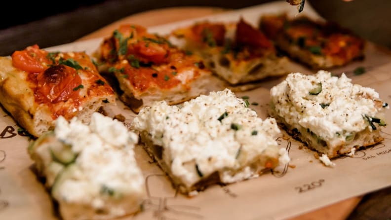 Slices of rectangular pizza with focaccia-like crust.