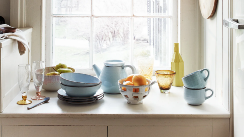 bowls and kitchen items on a windowsill