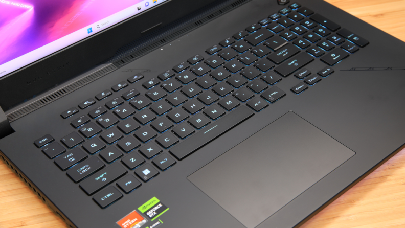 Close-up view of the keyboard and trackpad on the Asus ROG Strix SCAR 17 gaming laptop.