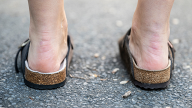 Girl wearing a pair of Birkenstock Boston clogs.