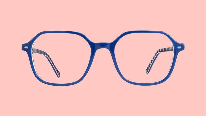 Front view of stylish, blue reading glasses from Ray-Ban on a pink background.