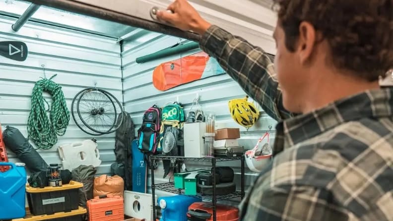 Man about to close the door to his self-storage unit