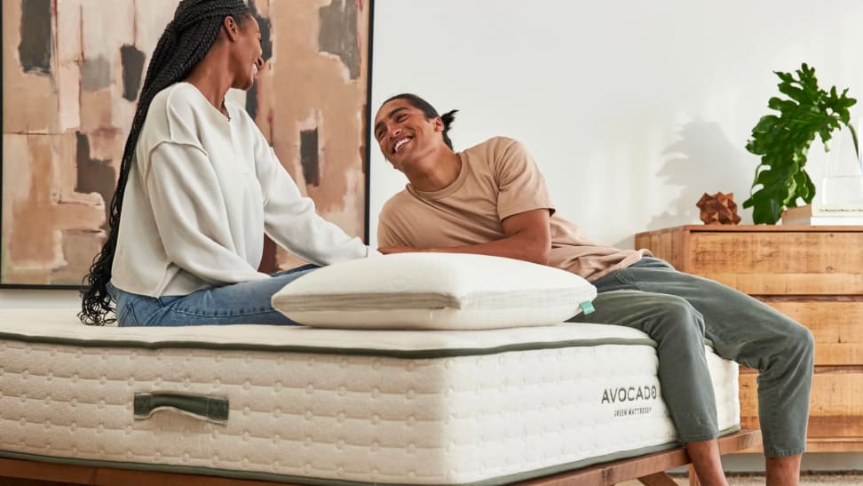 Photo of two people on an Avocado mattress.