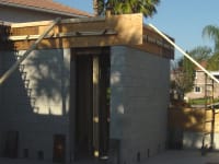 Safe room under construction with concrete walls, floor, and ceiling