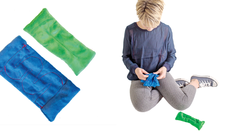 Left: One blue bean bag and one green bean bag; right: A child works a marble through a maze in a bean bag.