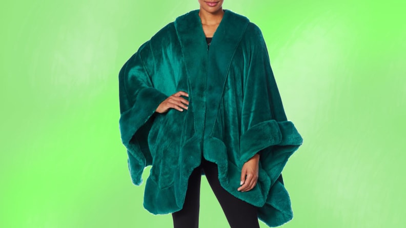 A person wearing a dark green background in front of a green background.