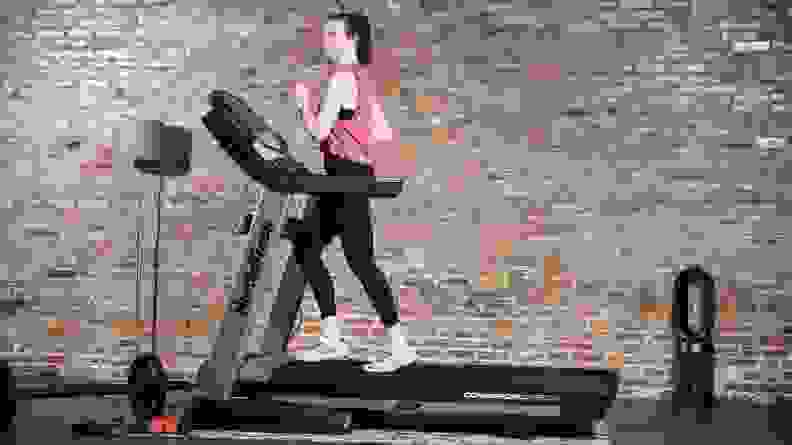 A person runs on a treadmill.
