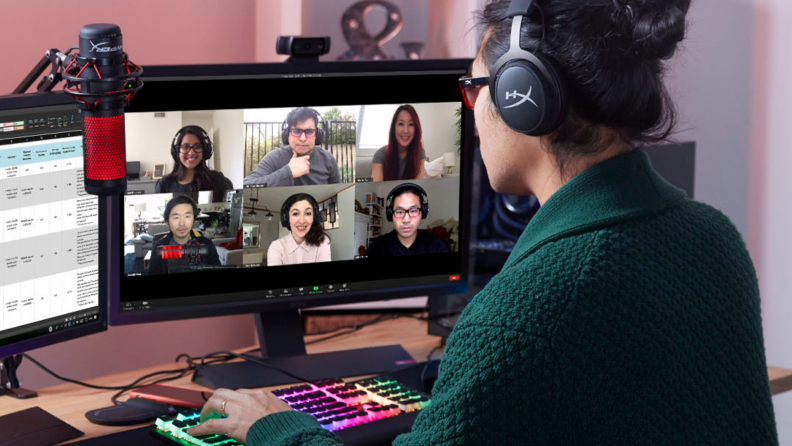 A person live streams wearing a headset while corresponding with other players.