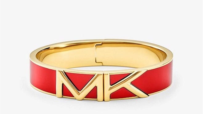 Red and gold bracelet with “MK” on it