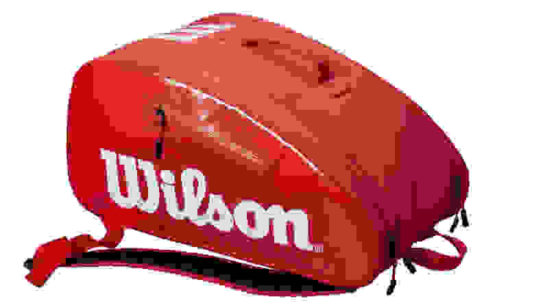 Red bag with Wilson white text on front on white background